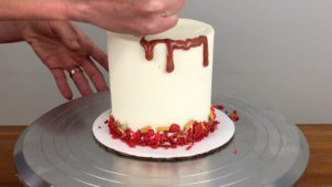 apply drip to edible gold cake