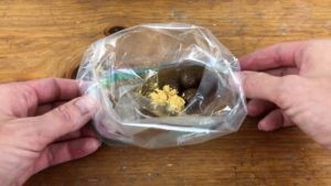 chocolates and gold luster dust in ziploc bag for edible gold cakes