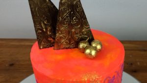 gold chocolates on edible gold cakes