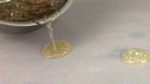 pour cooked sugar for homemade sugar lollipops for edible gold cakes