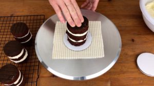 press mini cake onto cake board for how to make mini cakes