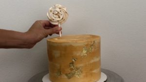 push gold meringue pops into edible gold cakes