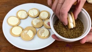 roll cookie sandwiches in gold glitter