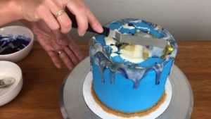 spread marble drip on top of cake for edible gold cakes