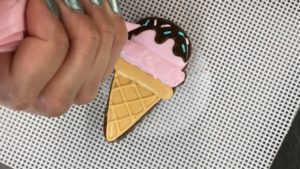 pipe sprinkles onto ice cream cookie 3 tricks for cookie decorating