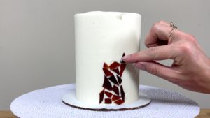 arrange jelly on cake to create design for Stained Glass Jelly Cake Tutorial