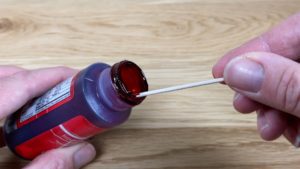 use a toothpick to get tiny amounts of gel to tint jelly for stained glass jelly cake tutorial