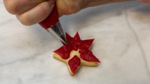 pipe petals on poinsettia cookie EASY Christmas Cookies