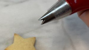 poinsettia on star cookie with leaf tip EASY Christmas Cookies