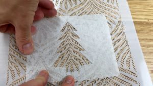 tape homemade stencil onto another stencil 6 sprinkle christmas cake decorating ideas