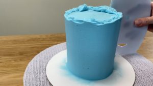 scrape frosting with a frosting smoother 7 Secrets For Smooth Frosting