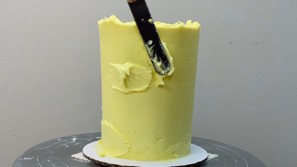 touch up gaps by spreading on more frosting How to Make a Birthday Cake