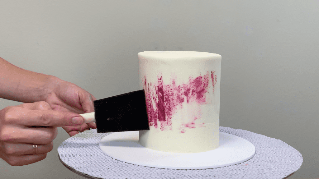 dab sponge with buttercream onto cake How to Paint on Cakes