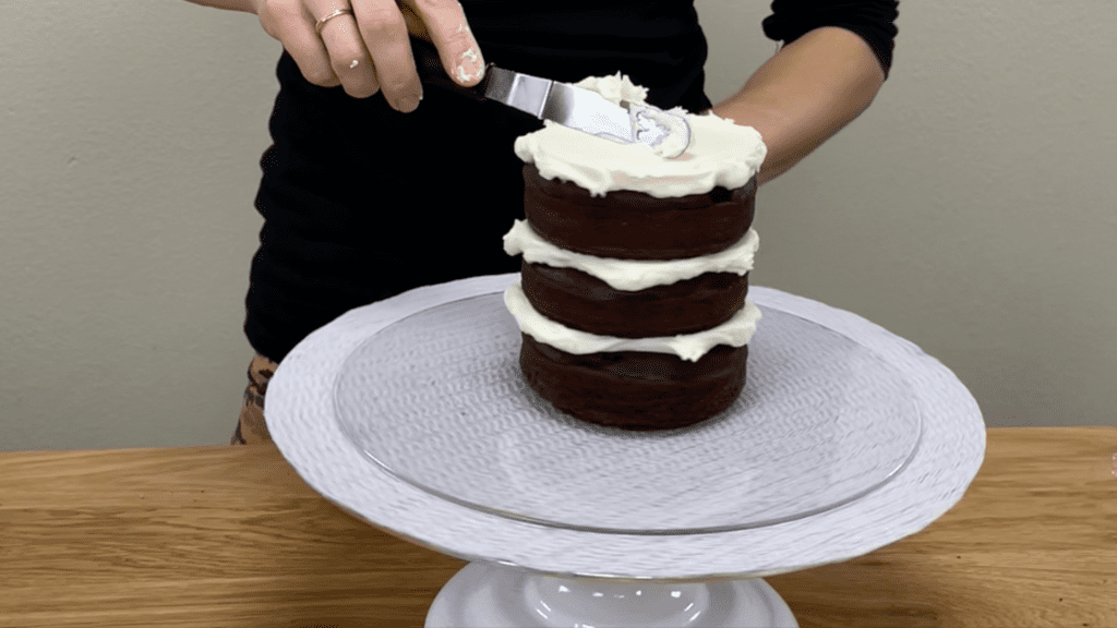 put damaged cake layers in the middle of a cake and frost over them 10 Cake Fails and How to Fix Them