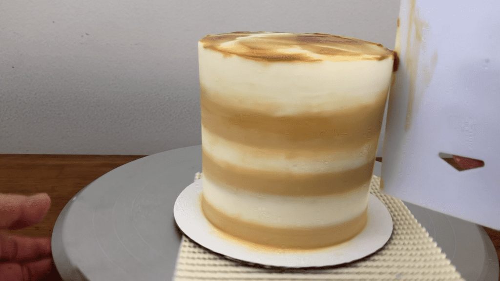 scrape drip off sides of cake with frosting smoother 10 Cake Fails and How to Fix Them