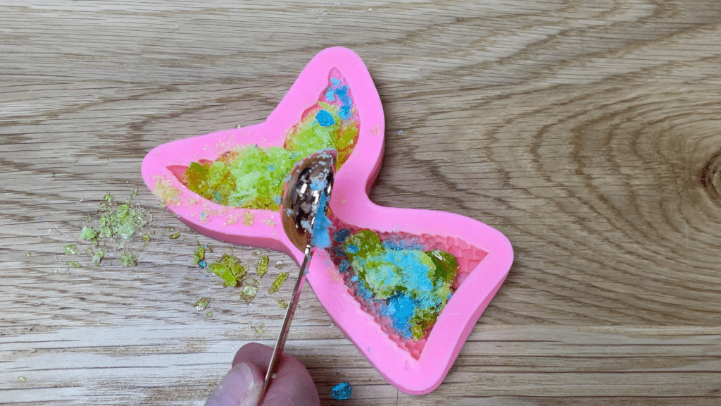 crush candy and fill mold to make cake toppers Candy Cake Decorating Hacks