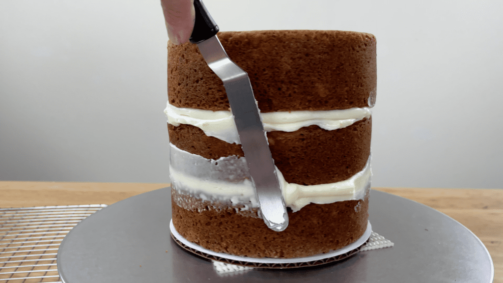 smooth filling around sides of cake to make frosting easier later How To Transport A Cake 2000 Miles