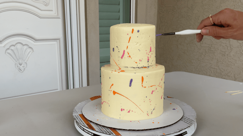 splatter edible paint over cake How To Transport A Cake 2000 Miles