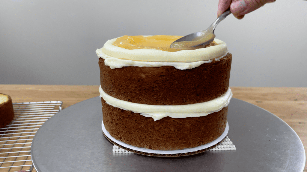 spread filling onto each cake layer How To Transport A Cake 2000 Miles