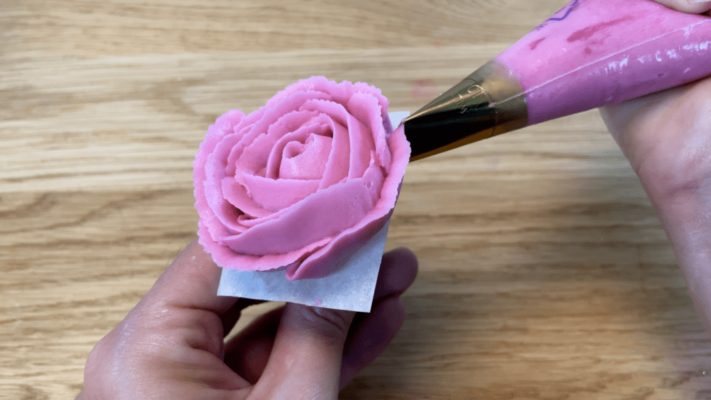 pipe flowers onto a flower nail 10 Must Have Cake Decorating Tools