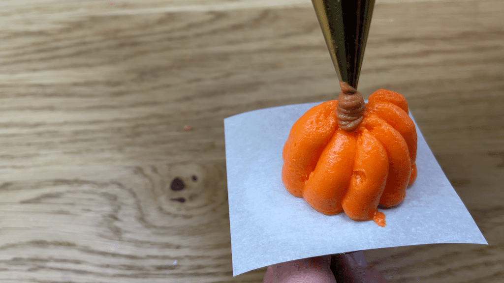 pumpkins piped on a flower nail 10 Must Have Cake Decorating Tools