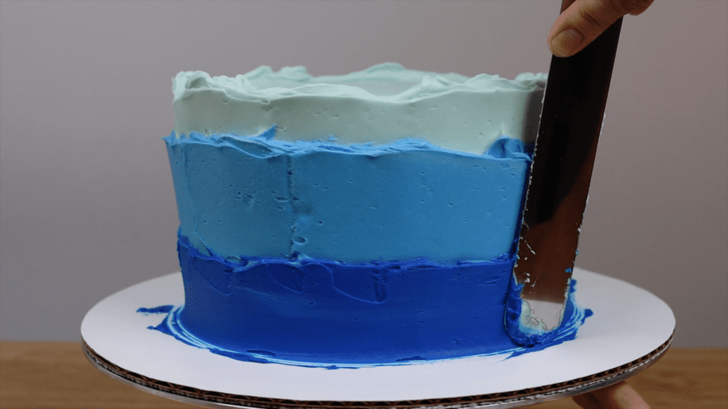 spread buttercream frosting thickly for final coat of frosting Which Cake Scraper Is Best?