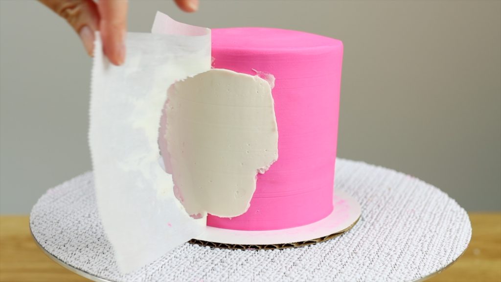 peel homemade cake stencil off and touch up outlien with toothpick 10 Halloween Cake Hacks