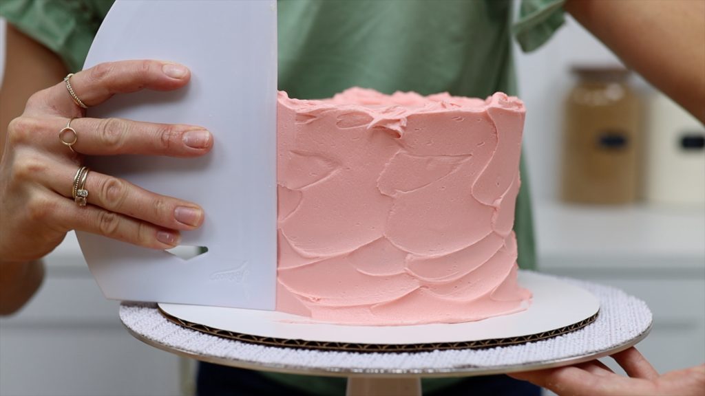 smoothing the frosting on cake 10 Tips for your First Cake