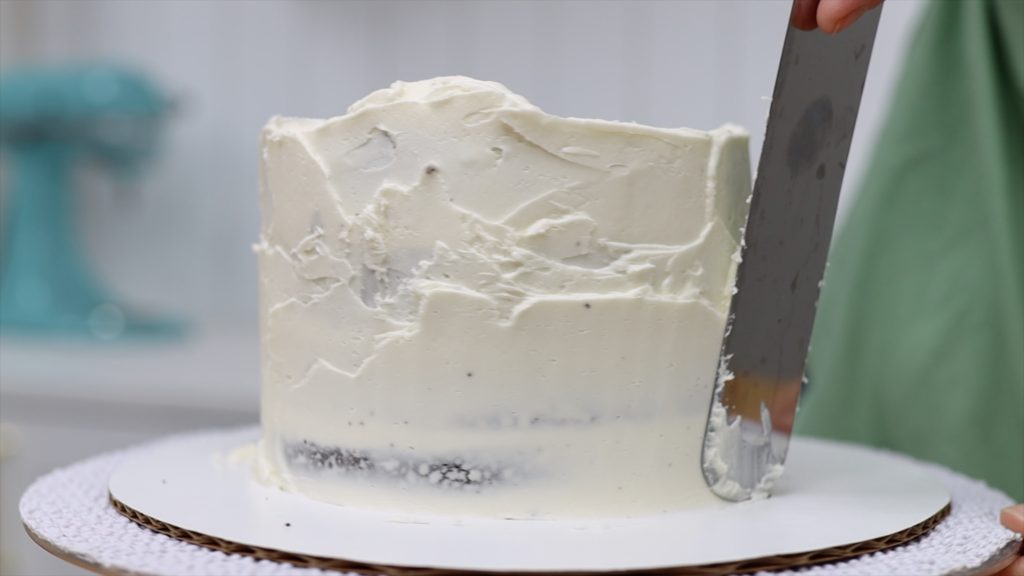 spread frosting onto cake for crumb coat 10 Tips for your First Cake