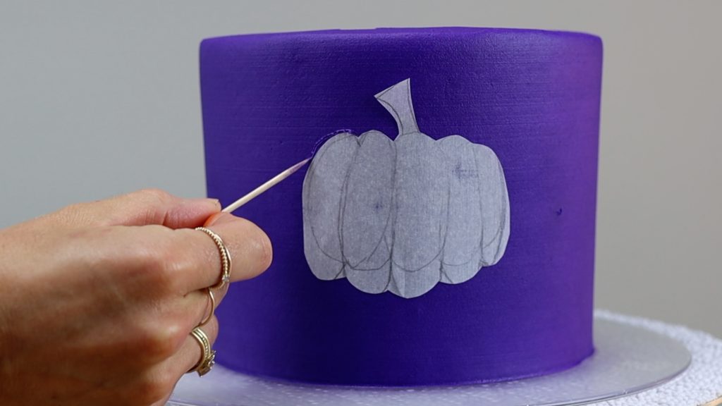 trace shape onto cake with toothpick 10 Halloween Cake Hacks