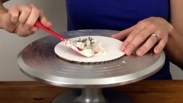 assemble cake on a cake board cookies and cream cake