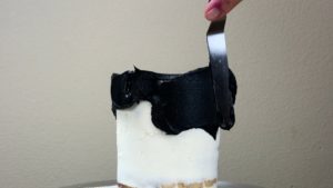 black buttercream that won't stain your teeth for striped halloween cake with gold buttercream pumpkins
