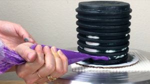 pipe buttercream into stripe grooves Halloween Cake With Gold Buttercream Pumpkins