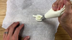 piping buttercream pumpkins with a 1M and open star tip
