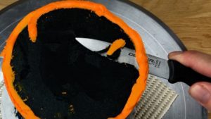 trim uneven edge off frosting with sharp knife Striped Halloween Cake With Gold Buttercream Pumpkins