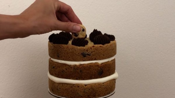 decorate chocolate chip cookie cake with mini chocolate chip cookies