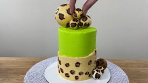 make leopard print chocolate sculpture on top of cake for trendy neon leopard print cake