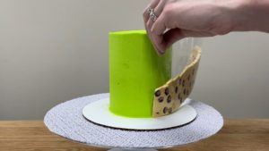 wrap leopard print frosting around cake for trendy neon leopard print cake