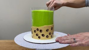 wrap leopard print frosting on acetate around cake for trendy neon leopard print cake