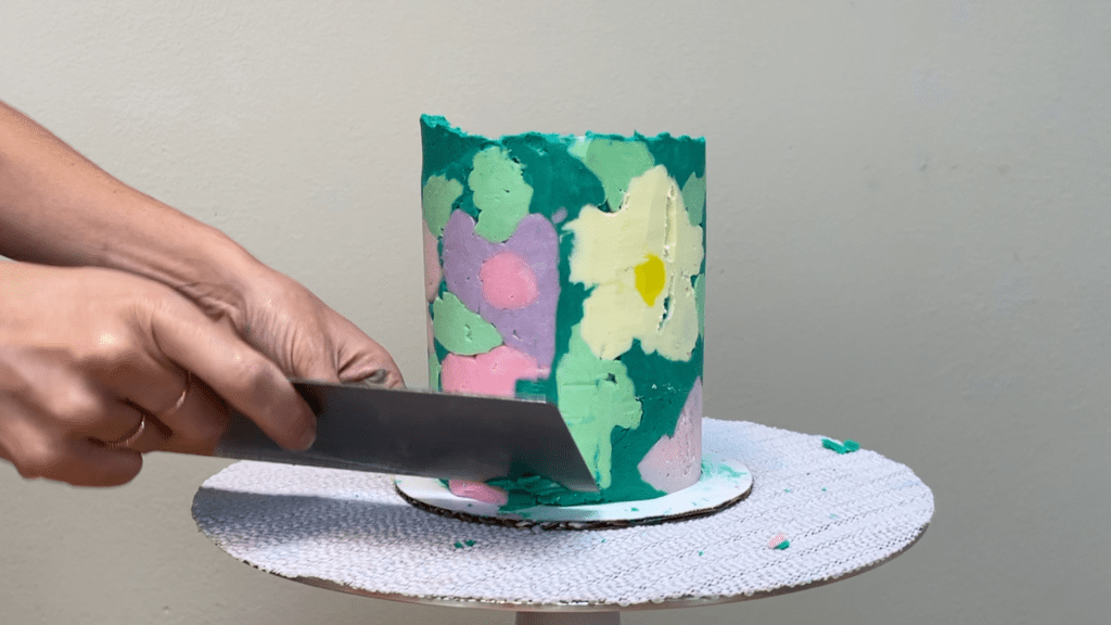 scrape seam with frosting smoother to flatten how to transfer any design onto a cake