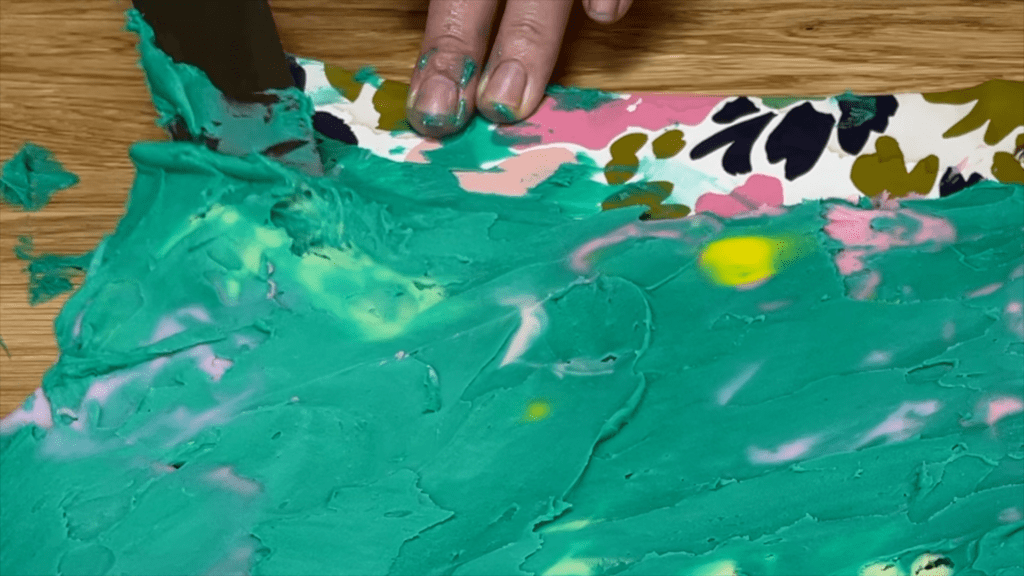 slide offset spatula under acetate to lift how to transfer any design onto a cake