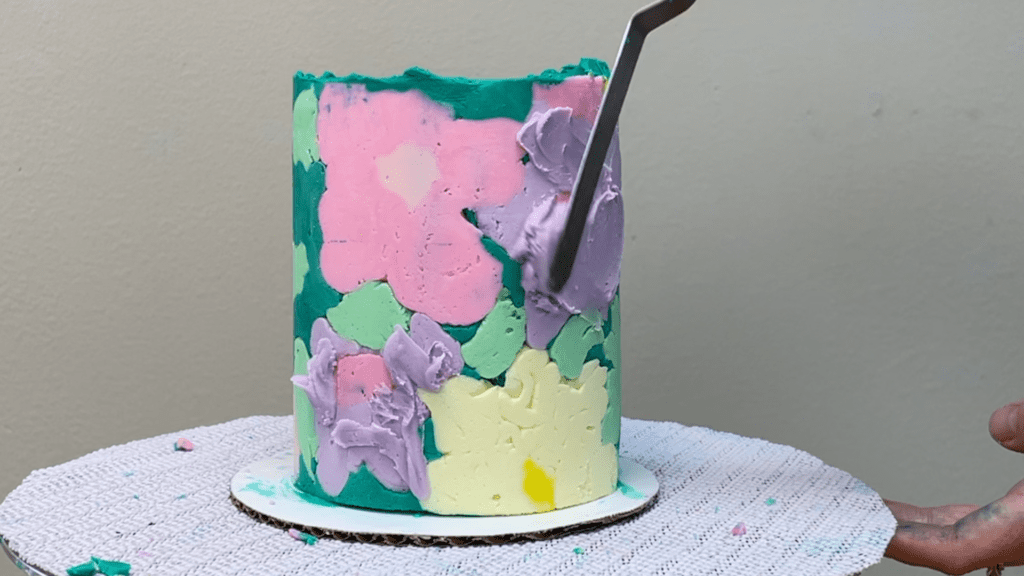 spread buttercream to push into air pockets how to transfer any design onto a cake