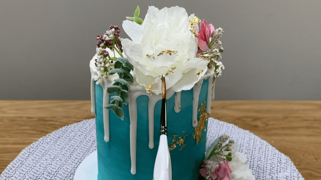 brush gold leaf onto artificial flowers How To Use Gold Leaf On Cakes