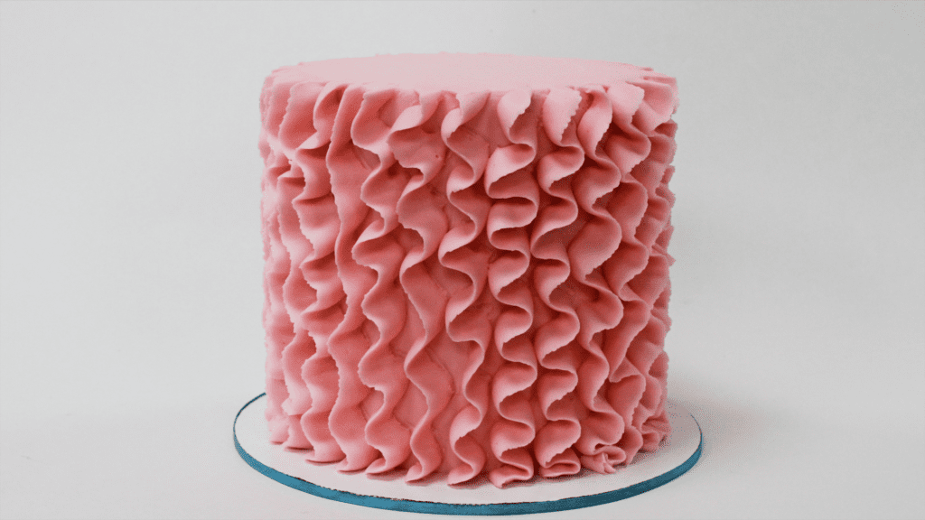 pink buttercream ruffle frosting on cake 5 Cakes You Can Decorate in 5 Minutes
