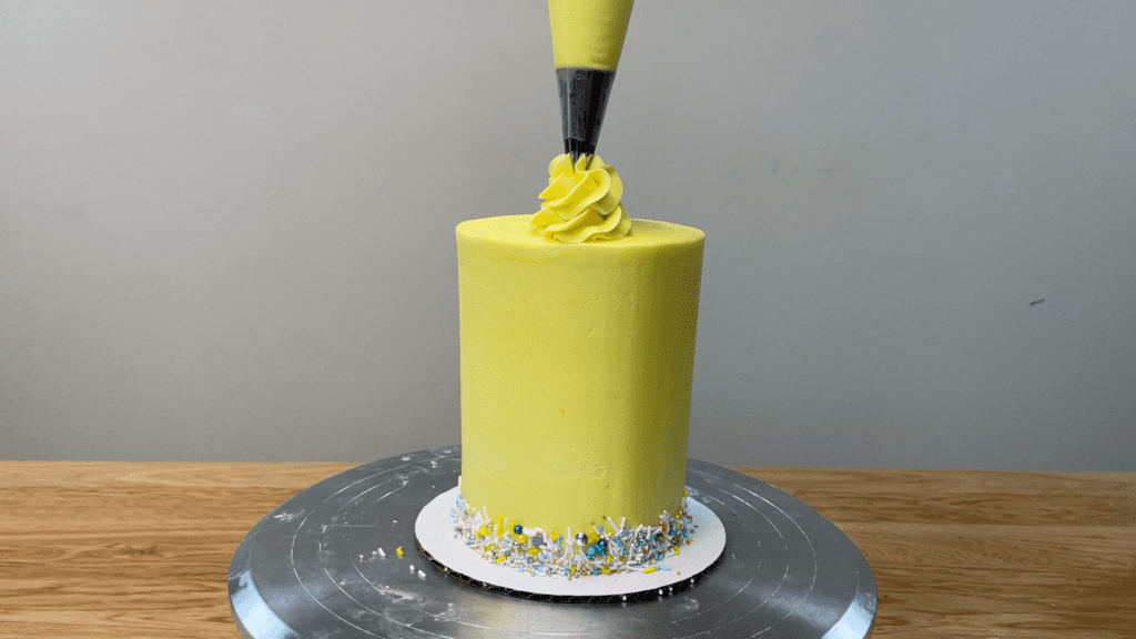 pipe swirls onto cake with 1M tip 5 Cakes You Can Decorate in 5 Minutes