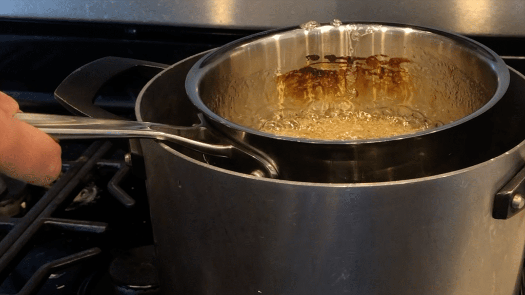 plunge pan into iced water at 310F to cool homemade sugar lollipops recipe