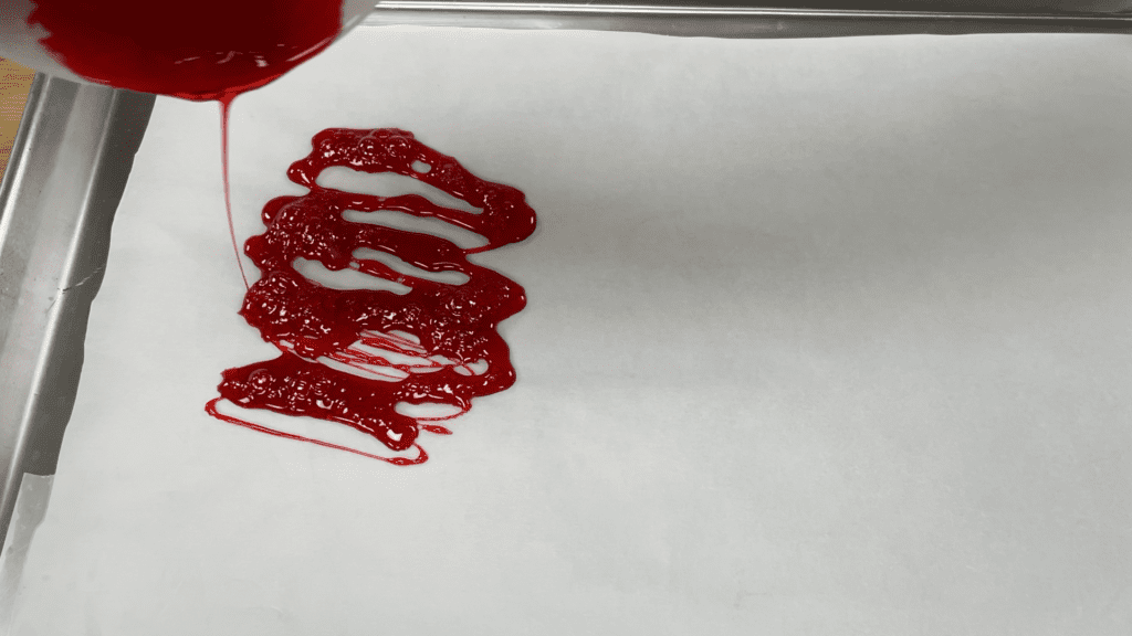 pouring melted jolly rancher hard candy imediately after melting 5 Cakes You Can Decorate in 5 Minutes