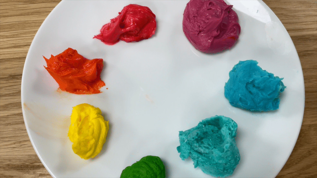 prepare buttercream palette with colours on plate 5 Cakes You Can Decorate in 5 Minutes