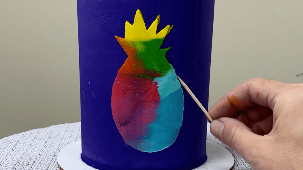 scrape off smudges from around stencil design using a toothpick 5 Cakes You Can Decorate in 5 Minutes