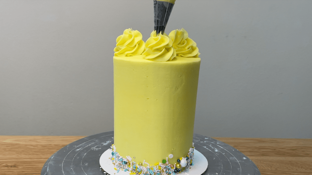 space piping evenly on top of cake using clock method 5 Cakes You Can Decorate in 5 Minutes
